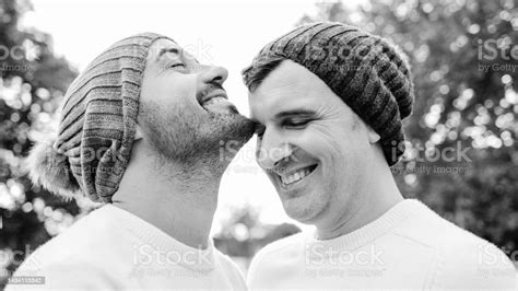 happy mature gay men couple having tender moment outdoor lgbtq love concept black and white