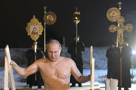 Russian President Vladimir Putin Takes Holy Dip In Icy Waters The