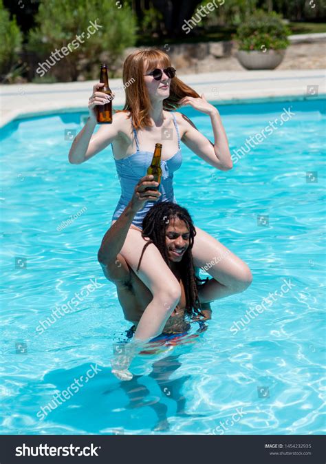 Interracial Couple Play Pool Shes On Stock Photo 1454232935 Shutterstock