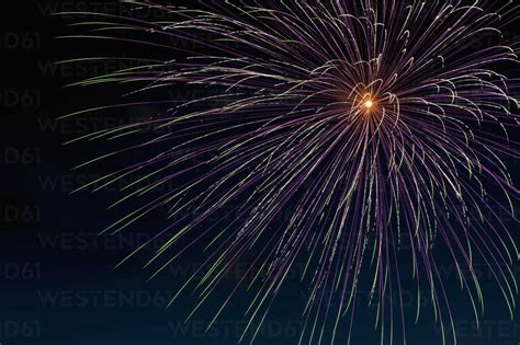 Fireworks Exploding In The Sky At Night Stock Photo