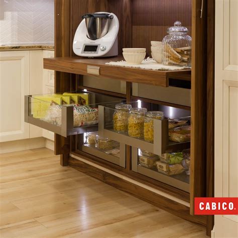 A Pull Out Countertop Transforms This Hidden Pantry Into A Workable