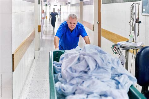 Hard Working Hospital Laundry Staff By Stocksy Contributor Per