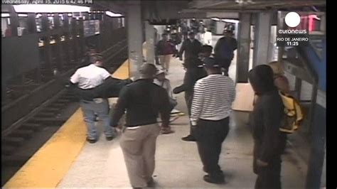 Subway Rescue Man Falls Onto Tracks Saved By Quick Thinking Onlookers Youtube