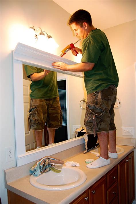 I added shelves and some trim to another amazing bathroom mirror transformation! framed mirror - diy - trim, crown molding, liquid nails ...