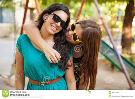 Casual friends hanging out together outdoors concept. Best friends hanging out stock photo. Image of teenager ...