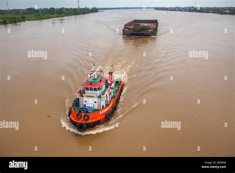 Industrial Barge Pulled By Tugboat On Batanghari River Jambi Sumatra