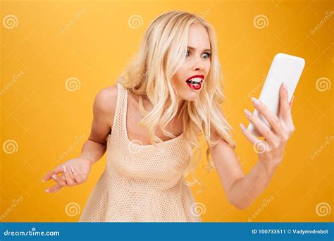 Confused Shocked Young Blonde Woman Using Mobile Phone Stock Image