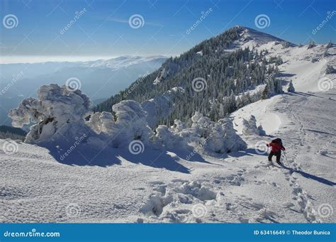 Winter Mountain Landscape Snow And Female Hiker At High Altitude