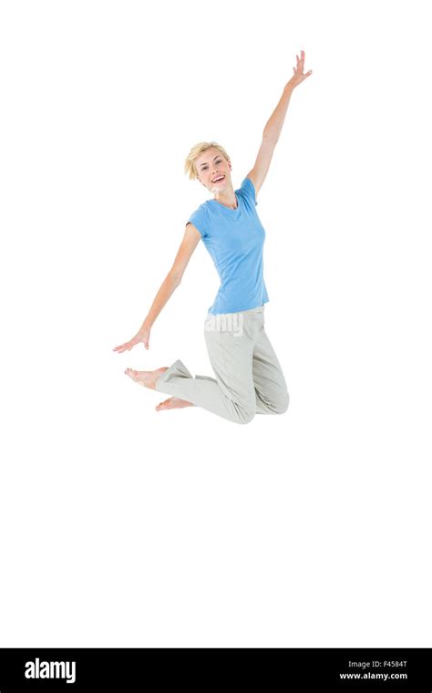 Cheerful Blonde Woman Jumping Stock Photo Alamy