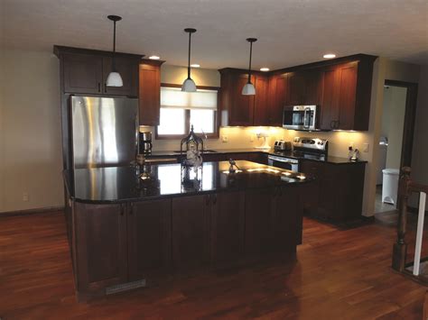 Get a unique kitchen with contemporary cabinets in extraordinary designs. Uba Tuba Granite Countertops | Cost of granite countertops, Dark oak cabinets, Granite countertops