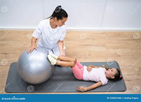 Balance Training Physiotherapy Exercise Treatment For Child Stock Photo