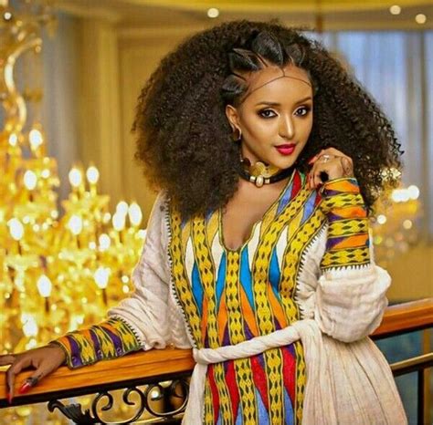 lady in beautiful habesha traditional kemis dress jewelry and albaso braids ethiopian braids