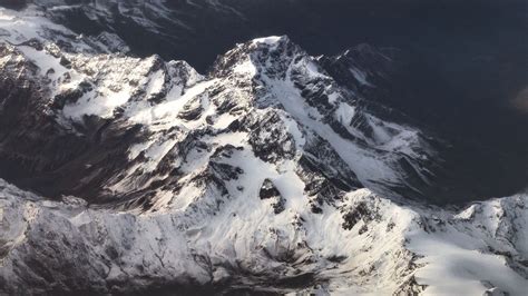 Download Wallpaper 1366x768 Mountains Snow Aerial View Mountain
