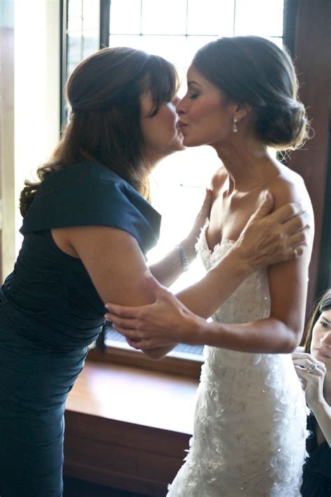 Bride Kisses Mother On Cheek Before Ceremony