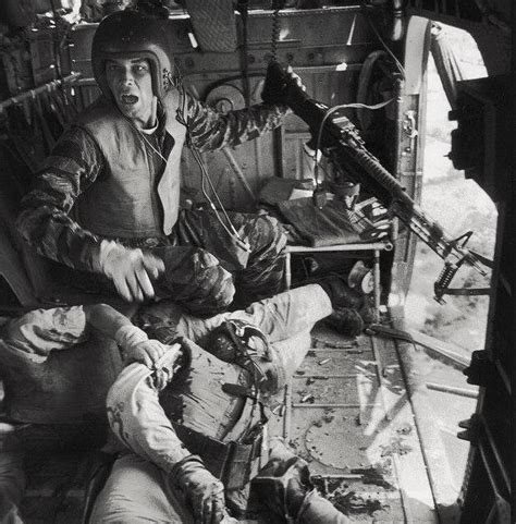 Us Army Door Gunner Attending To A Wounded Pilot Vietnam War 1965