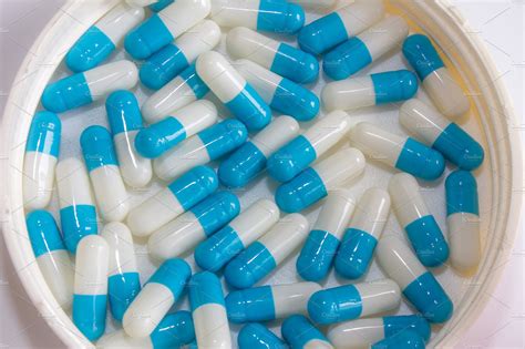 Blue White Capsule Drug Isolated Featuring Blue White And Isolated