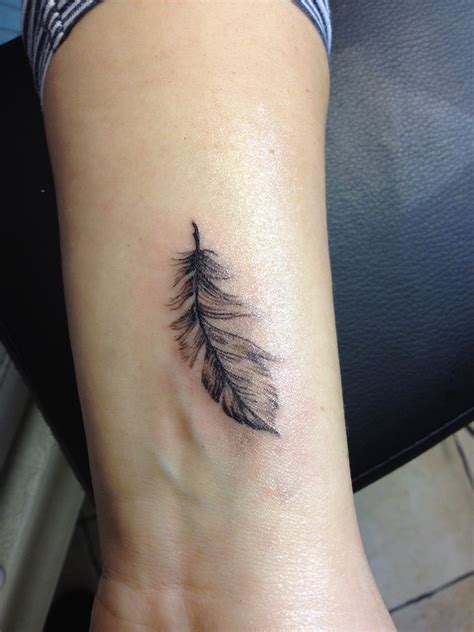 feather by Monika | Feather tattoos, Feather tattoo arm, Small feather ...
