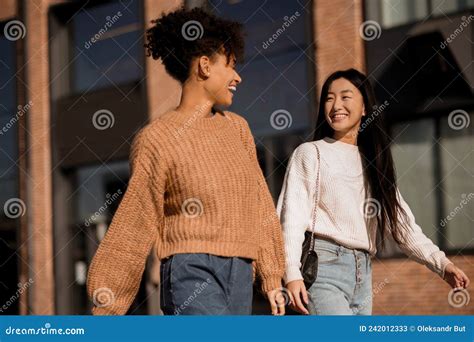 Two Cute Girls Walking Together In The Street Stock Image Image Of