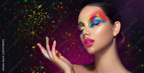 Beautiful Girl With Festive Bright Multi Colored Make Up On The Face