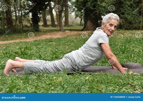 Elderly Woman Practicing Yoga Outdoors Stock Photo Image Of
