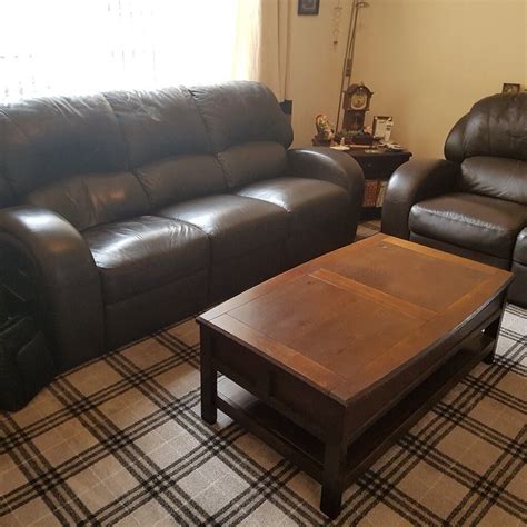 Two Brown Reclining Sofas Brown Leather Plus One Solid Wood Coffee