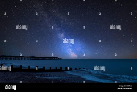 Stunning Vibrant Milky Way Composite Image Over Landscape Of Pier Under