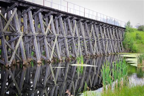 An Old Trestle Railroad Bridge Spanning A Pond Stock Image Image Of