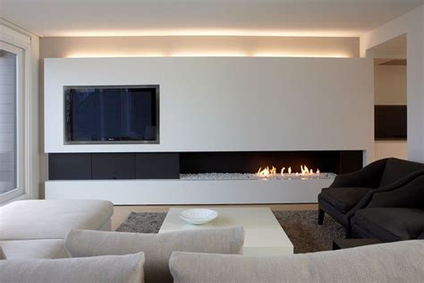 You will see some more traditional fireplaces that fit any style as well as some amazingly luxurious ones that will take your. TV with offset fireplace, so stacked rectangles don't get ...