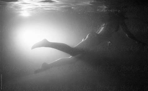Woman Swimming Underwater By Stocksy Contributor Simone Wave Stocksy