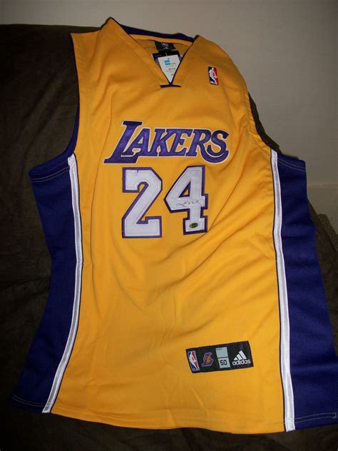 Wear your purple and gold all year. Kobe Bryant autographed authentic Lakers Gold Away Jersey