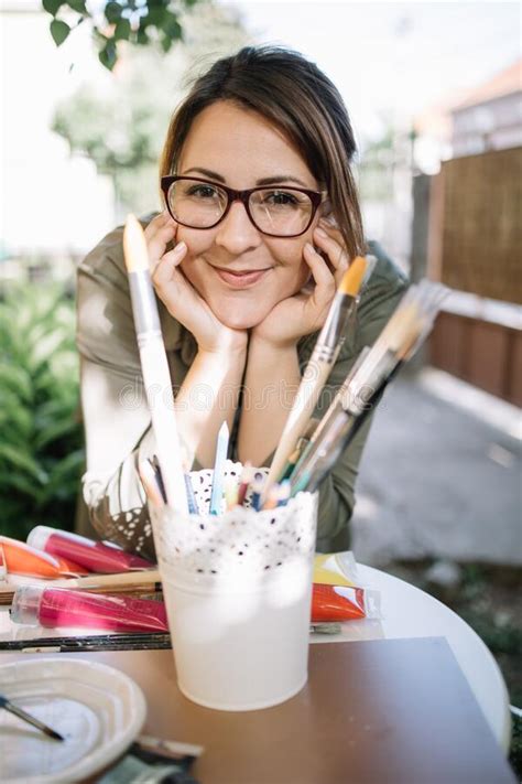 Cute Woman With Glasses Posing And Looking At Camera Stock Image