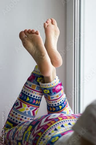 Photo Stock Sexy And Beautiful Female Soles And Feet Crossed On Windowsill Adobe Stock