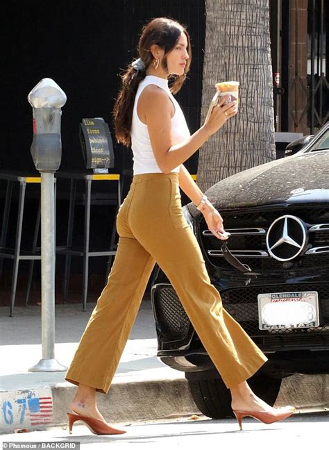 Eiza Gonzalez Showcases Her Figure In High Waist Pants And A Tight White Top While Getting A