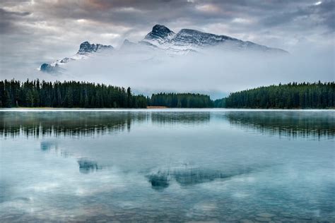 Snow Capped Mountain Near Body Of Water And Trees Photo Free Canada
