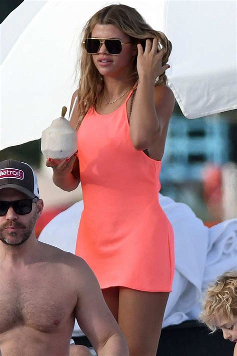 Sofia Richie Wears A Coral Pink Dress Over Her Bikini While Relaxing At