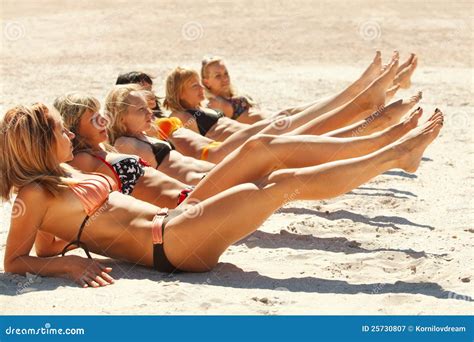 Several Girls In Bikini Lying On Sandy Beach Stock Image Image Of Line Girl