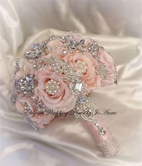 The Bridal Bouquet Is Adorned With Swaro Crystals And Pink Roses As