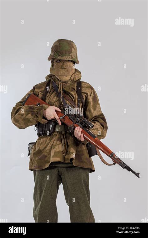 Actor Man In An Old Military Uniform And Camouflage Sniper Marksman