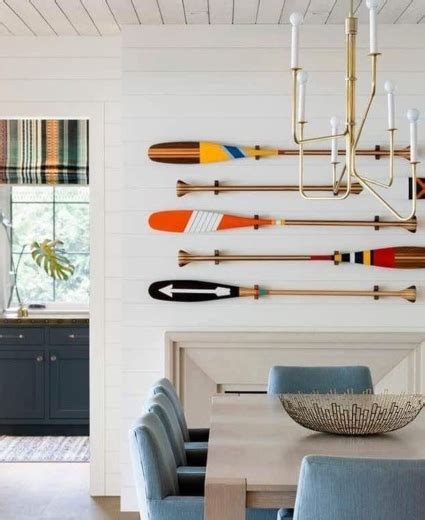 We show you how to us old paddles to create an amazing wall art. Painted Oars & Art Paintings on Oar Paddles - Coastal Decor Ideas Interior Design DIY Shopping