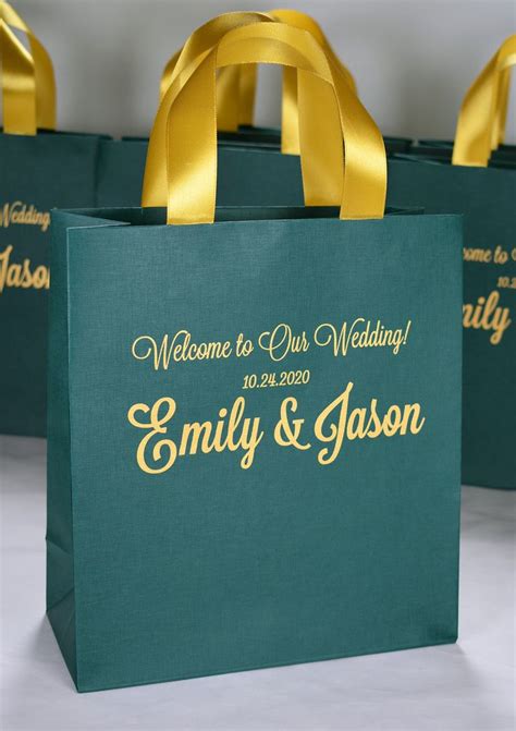 Three Green Bags With Gold Handles Are Sitting On A White Surface One