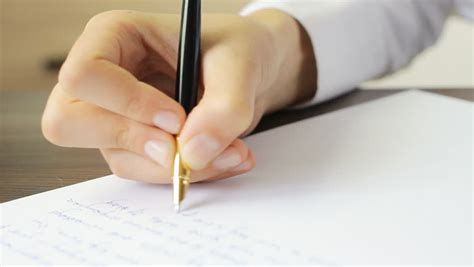 Woman Writing Answer With A Pen On The Sheet Of Paper Stock Footage