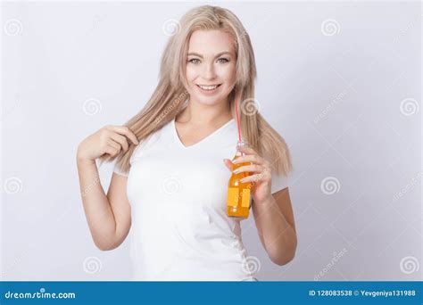 Blonde Woman With Orange Soda In Her Hands Stock Photo Image Of