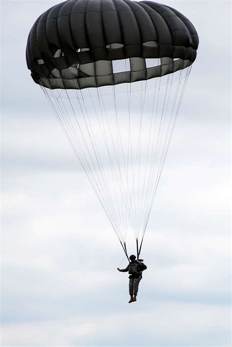 A Us Army Paratrooper Parachutes To The Ground Following Nara