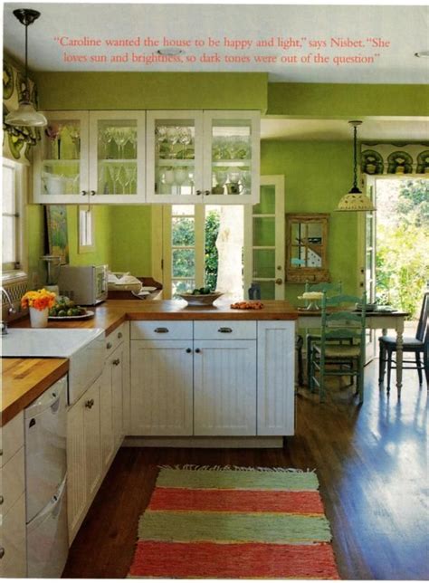 The bright green on the walls looks good against bright white cabinets and trim, and the shade is also a great compliment to the blue walls in the adjacent room. Green Kitchen Design Kitchen Design Blog | Green kitchen ...