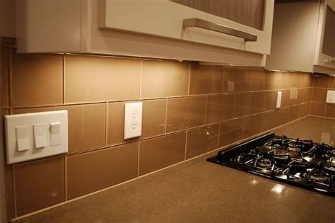 Working behind the kitchen faucet can be tricky, but do your best to reach the trowel teeth back behind the faucet from both sides. Khaki Glass 4" x 12" Subway Tile | Glass tile backsplash ...