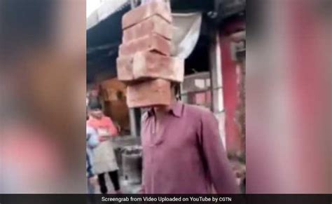 Look Ma No Hands Man Lifts 6 Bricks With His Teeth In Amazing Video