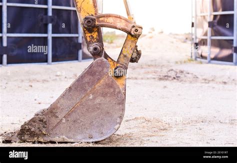 A Close Up Of A Backhoe Hand On The Ground After Finishing Work Stock