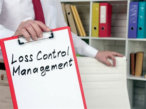A Manager Shows Red Clipboard With Loss Control Management Stock Image