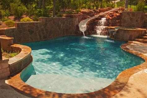 92 degrees is like bath water. pool with slide, hot tub and waterfall | Pool designs ...