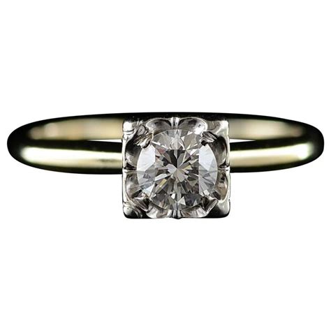 The combined weight of all the diamonds accenting this princess style engagement ring is 0.67 carats. 1940s 0.43 Carat Diamond Solitaire Engagement Ring For Sale at 1stdibs
